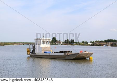French wooden oyster boat at the river the Charente