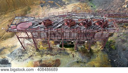 Old Industrial Structure With Trolleys And Rails At An Abandoned Copper Mine, View From Above
