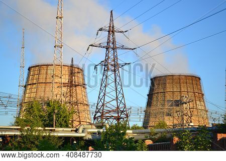 Two Cooling Pipes, Power Lines And Pipes With Hot Water