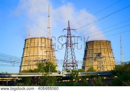 Two Cooling Pipes, Power Lines And Pipes With Hot Water