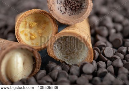 Sweet Conus Candy With Chocolate. Brown Background