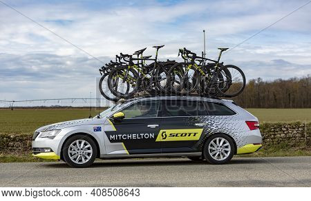 Fains-la-folie, France - March 5, 2018: The Technical Car Of Mitchelton Scott Team Driving On A Coun
