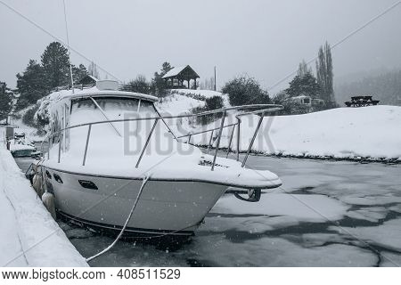 Fishing Boat Covered In Snow At A Marina In Pedder Bay, Vancouver Island, British Columbia, Canada