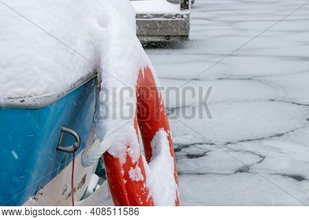 Life Ring On A Boat Covered In Snow And Ice