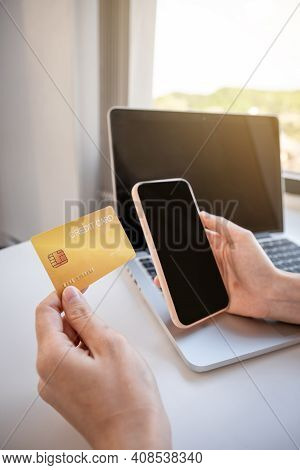 Young Asian Consumer Woman Hand Holding A Credit Card, Ready To Spending Pay Online Shopping Accordi