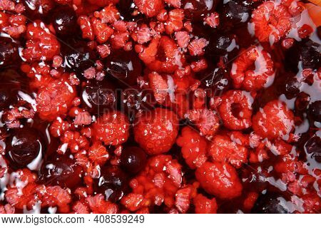Texture Of Red Raspberry Jelly Berries. From Top To Texture Red Background