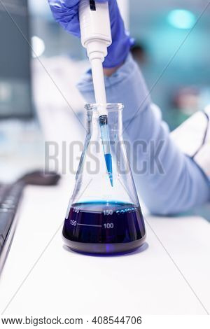 Close Up Of Micropipette Dipping In Test Tube For Science Experiment. Pharmacy Scientist Doctor Disc