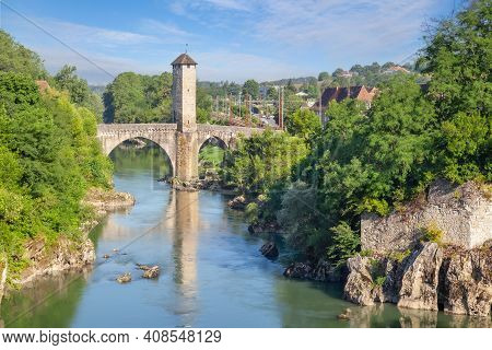 Orthez, France. View Of Romanesque Le Pont Vieux Bridge Over Ousse River