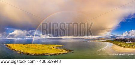 Aerial View Of An Rainbow Above The Atlantic Ocean And Inishkeel By Portnoo In Donegal - Ireland