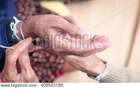 The Ceremony Of Binding Elderly People's Wrist With The Holy Thread To Console Old People's Kwan. Th