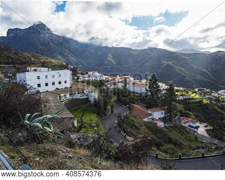 Picturesque Canarian Village Tejeda In Mountain Valley Scenery With Road Serpentine And View Of Cald