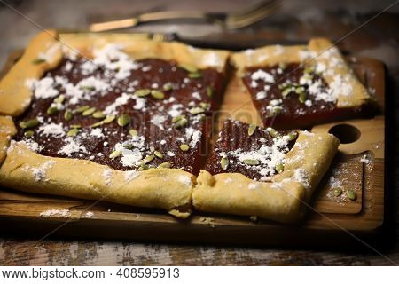 Homemade Square Galette With Confiture And Pumpkin Seeds.