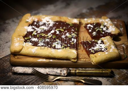 Homemade Square Galette With Confiture And Pumpkin Seeds.