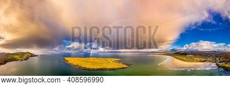 Aerial View Of An Rainbow Above The Atlantic Ocean And Inishkeel By Portnoo In Donegal - Ireland