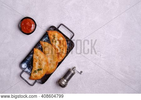 Fried Burekas With Filling On A Light Stone Background. Top View. Selective Focus.