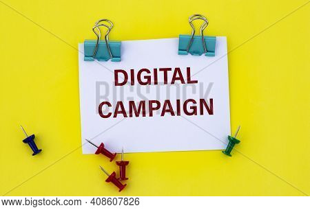 Digital Campaign - Word On White Paper With Clips On Yellow Background With Buttons And Pencil. Tech