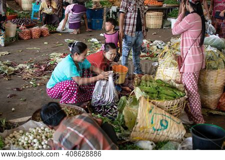 Yangon, Myanmar - Decemeber 31 2019: Many Burmese People Visits A Local Street Market To Buy And Sel