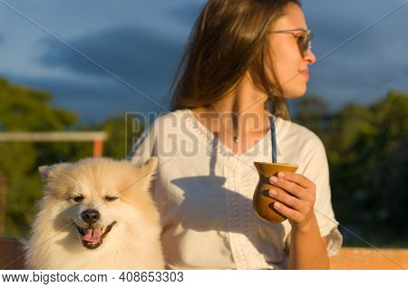 Blonde Woman Taking Traditional Gaucho Chimarrao