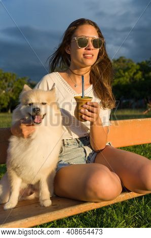 Blonde Woman Taking Traditional Gaucho Chimarrao