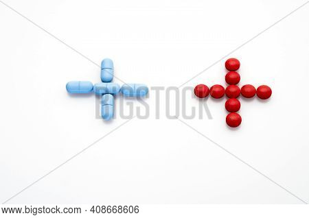 Medicine Sign Made From Red And Blue Pills Isolatad On White Background , Medicine Concept