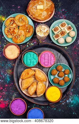 Traditional Indian Festival Food And Gulal Colors. Happy Holi Concept.