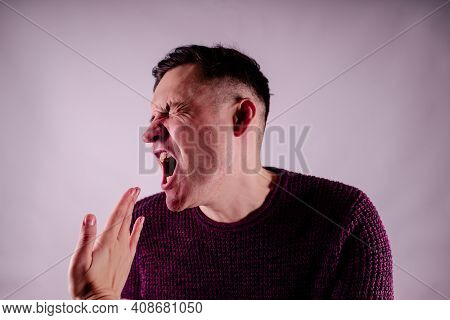 Crop Person Slapping Scared Man In Face. Emotional Male Getting Slapped In Face While Shouting With