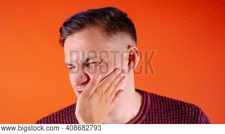 Crop Person Slapping Scared Man In Face. Emotional Male Getting Slapped In Face While Shouting With