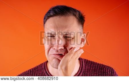 Crop Person Slapping Scared Man In Face. Emotional Male Getting Slapped In Face While Shouting With