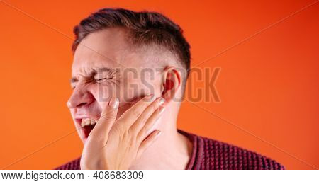 Crop Person Slapping Scared Man In Face. Emotional Male Getting Slapped In Face While Shouting With