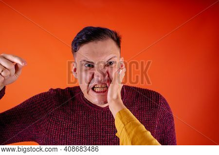 Crop Person Slapping Scared Man In Face. Emotional Male Getting Slapped In Face While Shouting With
