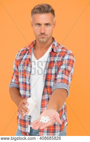 Food Additives Vitamins Male Health. Vitamin Complex. Handsome Man Presenting Product Selective Focu