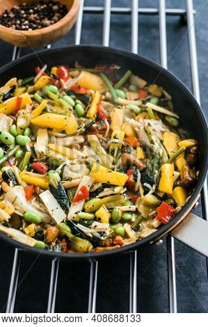 Fresh Asian Vegetables Mix, Thai Wok In A Black Pan On The Black Background With Copy Space. Healthy