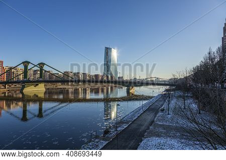 View Over River Main In Frankfurt With Floesser Bridge And European Central Bank Building With Sun R