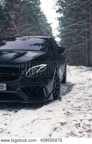 Kherson, Ukraine - February 2021. Powerful Mercedes-amg E63s Brabus 800 In A Black Color In The Wint