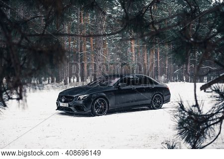 Kherson, Ukraine - February 2021. Powerful Mercedes-amg E63s Brabus 800 In A Black Color In The Wint