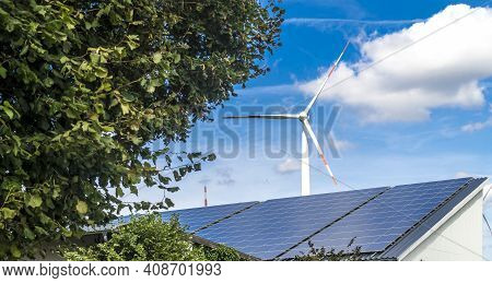 Windmill Sourround Blue Clouds In Summertime In Germany