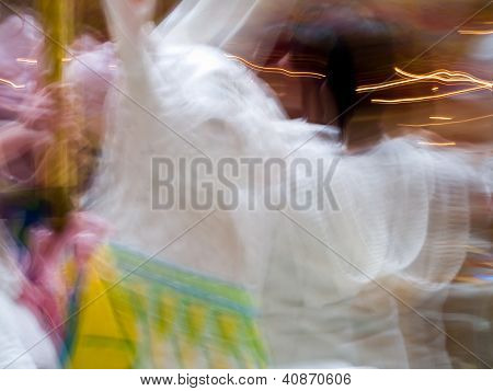 Carousel Horses In A Merry Go Round With Colorful Motion Blur