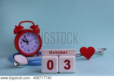 October 3. Day Of The 3th Month, Calendar Date. White Wooden Calendar Blocks With Date, Clock And St