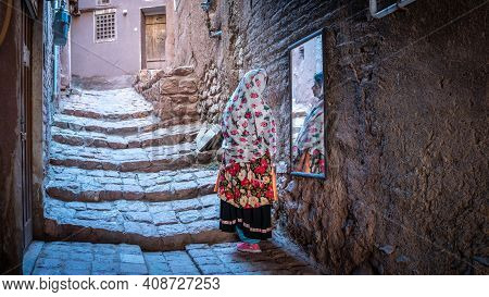 Abyaneh, Iran - May 2019: Unidentified Iranian Woman With Traditional Abyaneh Persian Dress