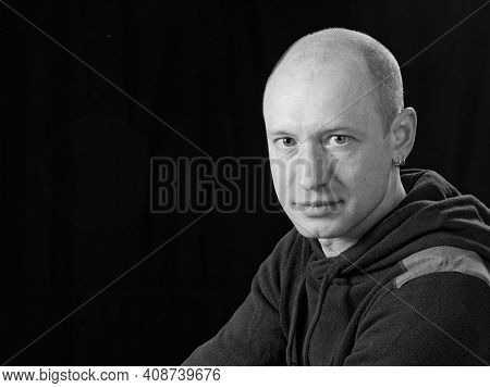Bw Portrait Of A Bald Man On A Black Background