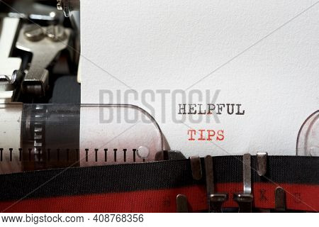 Helpful tips phrase written with a typewriter.