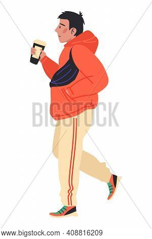 Side View Of A Young Man Walking Forward With Coffee In His Hand And Waist Bag