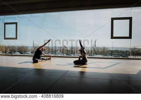 Prenatal Personal Yoga Class In A Spacious Gym With Large Windows And A Beautiful View. Yoga Teacher