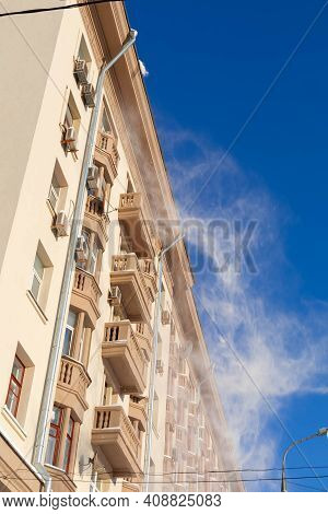 15.02.2021, Russia, Moscow. Utilities Of The City Clean The Roof Of A Multi-storey House From Snow.