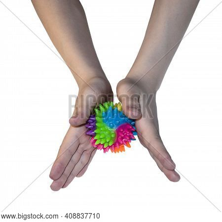 Children's Hands Roll A Spiky Rubber Ball For Self-massage Of The Palms And Fingers. Early Developme