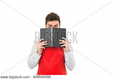 What To Cook. Man Hipster Cook Apron Reading Book About Culinary. No Idea How Cook Food. Culinary Bo