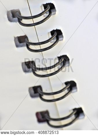 Close-up View Of Spiral Bound White Note Book
