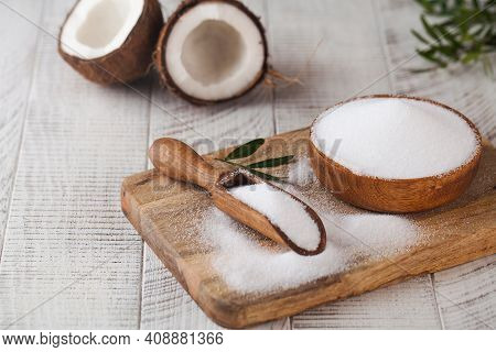 Sugar Substitute In A Wooden Bowl On A Background Of Coconut. Natural Sweetener. Stevia, Erythritol.