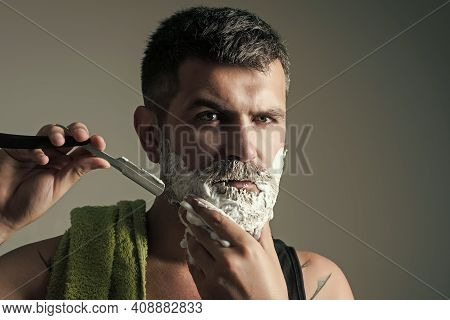 Hipster In Barbershop. Man Cut Beard And Mustache With Razor And Shaving Brush. Haircut Of Bearded M
