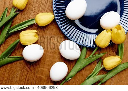 Flowers Arent Easter Eggs Blue Plate On Wooden Table